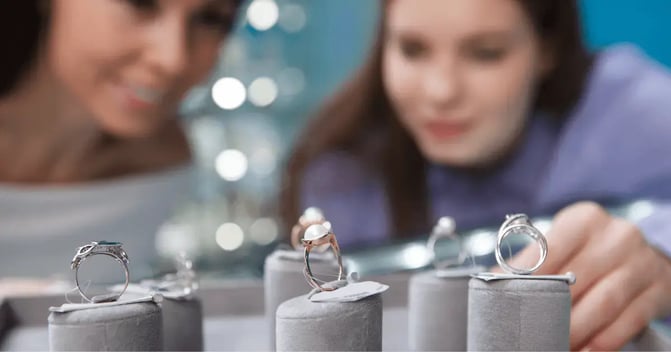 Two women window shopping for rings