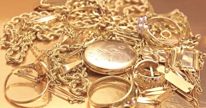 gold jewelry sitting on a table