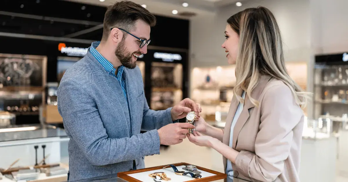 Manager assisting a jewelry store customer