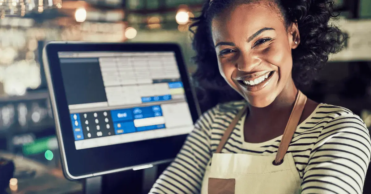 Woman standing in front of a POS system