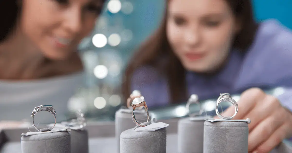 Two women window shopping for rings